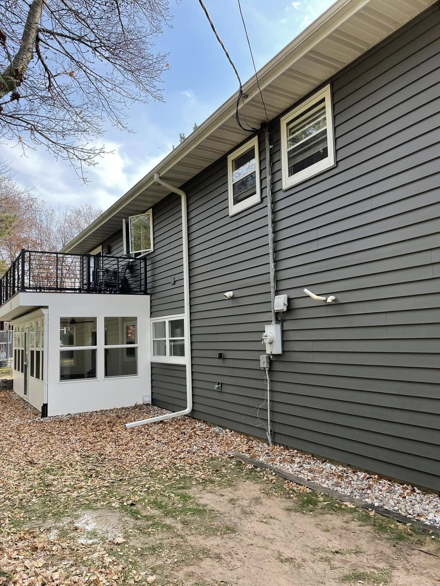 gray residential home with new siding